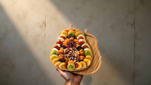 Set Festive Dried Fruit and Nuts Gift on Bamboo Cutting Board