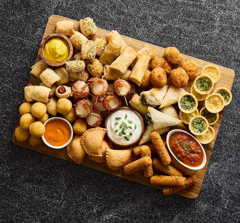 Generic Mac and Cheese Bites , Cavatappi pasta and a creamy, three-cheese filling coated in panko bread crumbs. Crispy