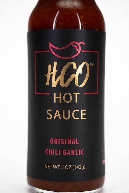 HCO Hot Sauce - Mild, Smoky and Slightly Sweet. A cross between Chili Sauce, Hot Sauce and BBQ Sauce. Pizza, pasta, wings, eggs and much more. Hot Crispy Oil influenced.