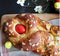Generic Tsoureki Greek Easter Braided Bread with Red Egg, Topped with Sliced Almonds