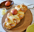 Generic Tsoureki Greek Easter Braided Bread with Red Egg, Topped with Sliced Almonds