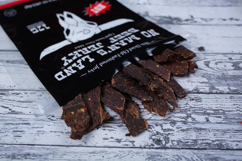 17G 16oz No Mans Land Premium Beef Jerky | High Protein Slow-Dried Beef Snack | Smoked & Seasoned Jerky Strips | HOT