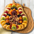 Set Festive Dried Fruit and Nuts Gift on Bamboo Cutting Board