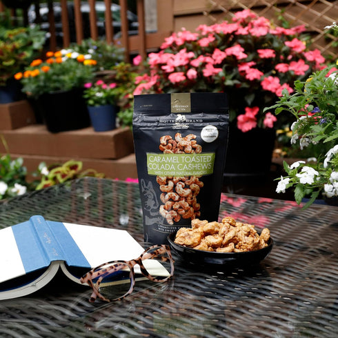 3.5 oz 3.5 Squirrel Brand Caramel Toasted Colada Cashews with sweet toasted coconut, natural flavors + Squirrel Brand